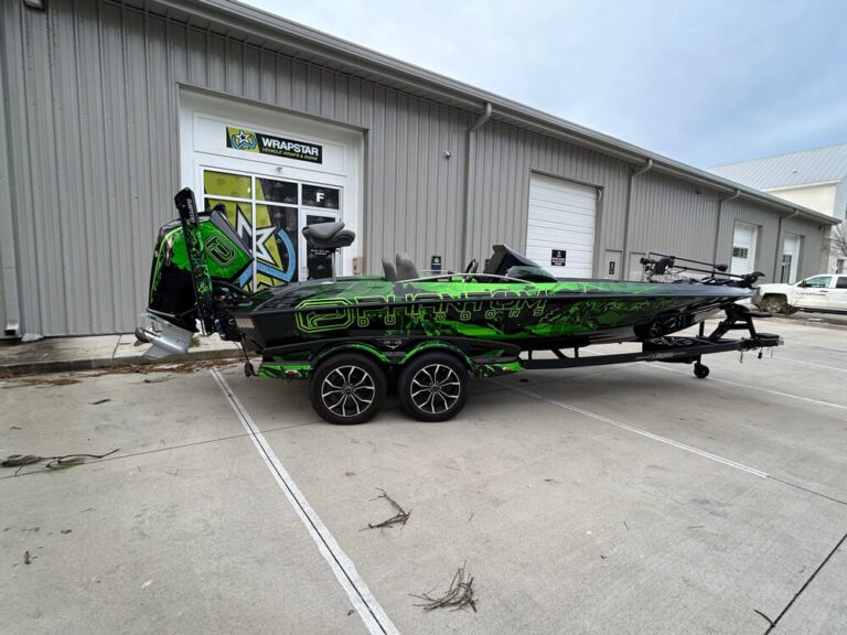 The same green and black camouflage-wrapped bass boat and trailer shown elsewhere in this batch.