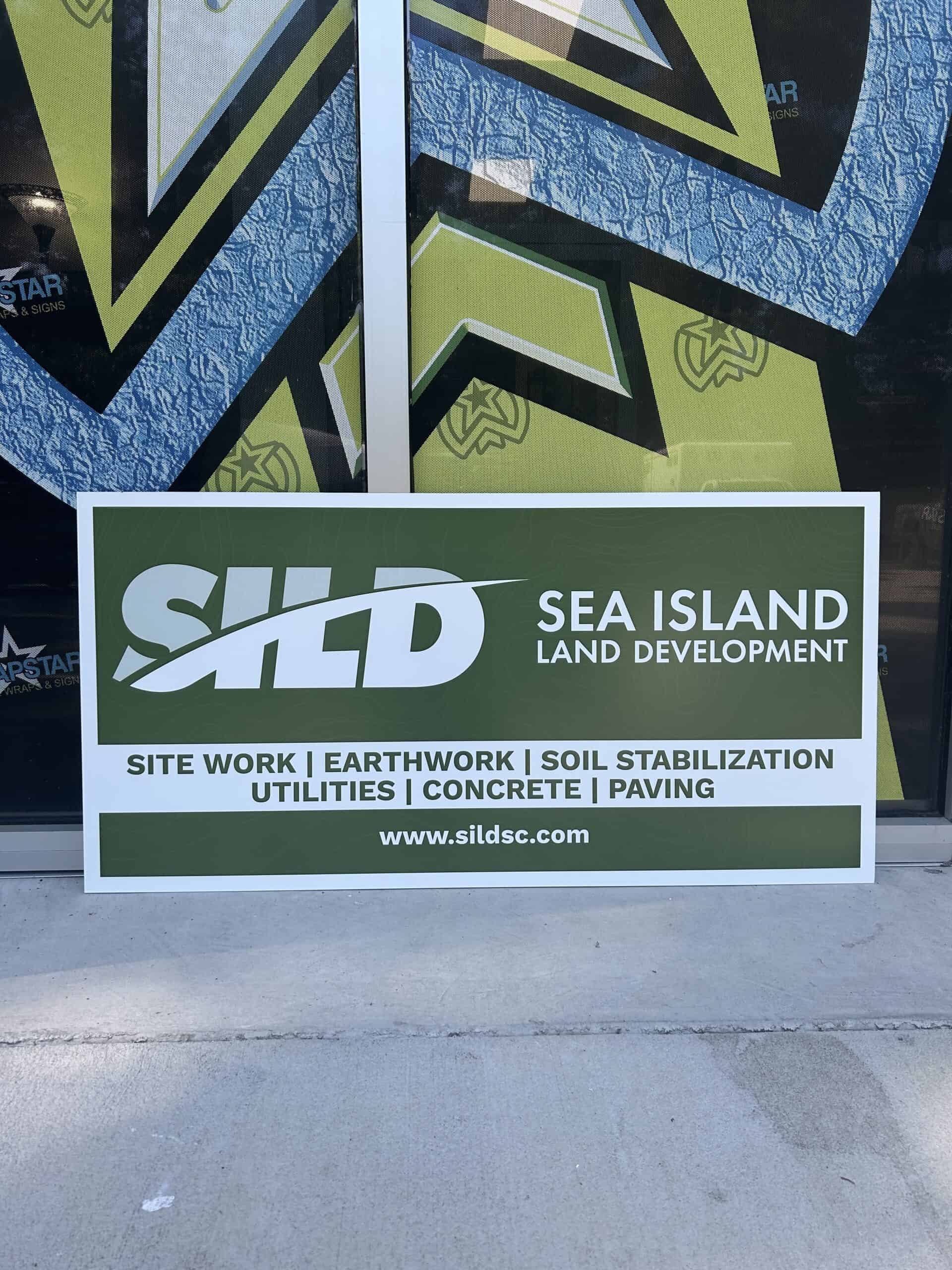 Custom vehicle wrap for Sea Island Land Development promoting site work and land services.