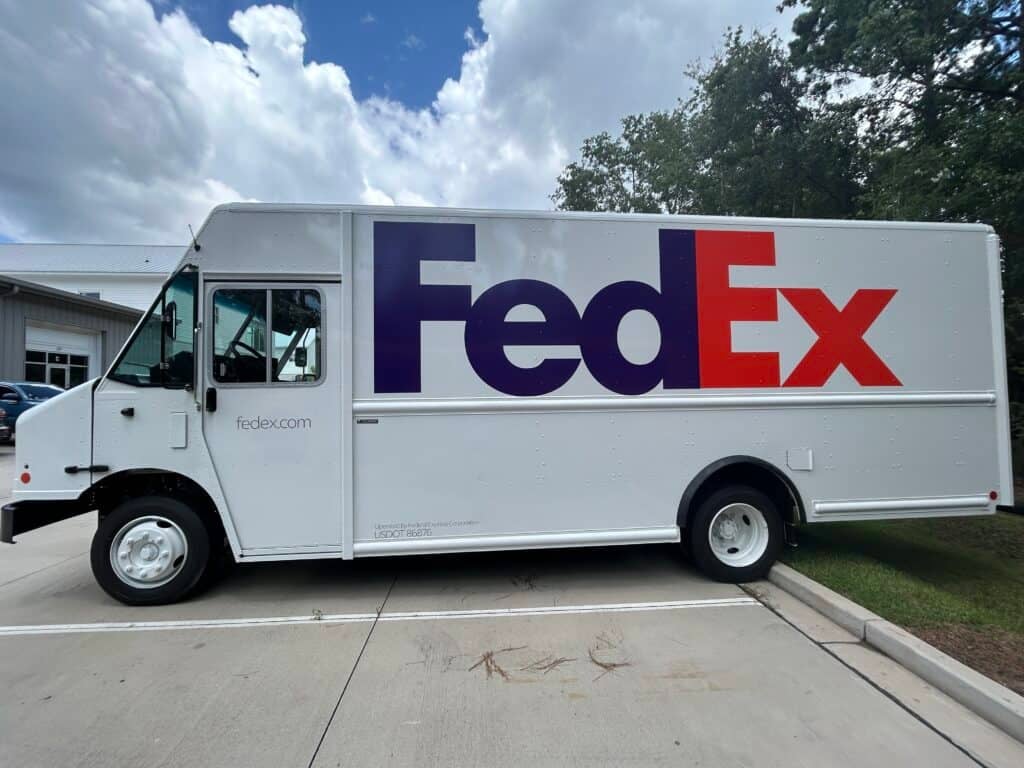 FedEx delivery truck with custom vehicle wrap in Charleston.