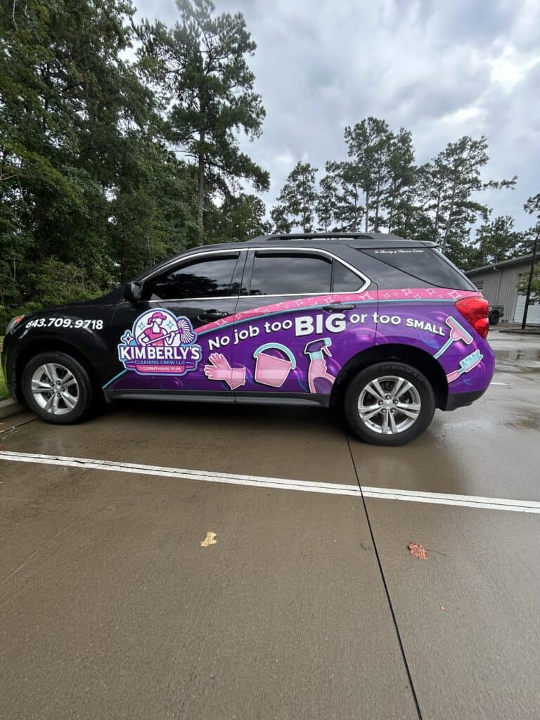 A black SUV wrapped in purple cleaning-themed graphics promotes Kimberly's Cleaning Crew.