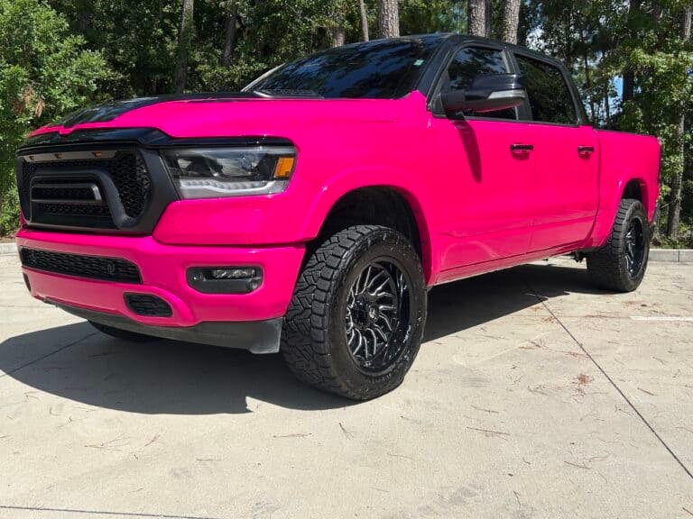 Bold pink vehicle wrap for trucks.