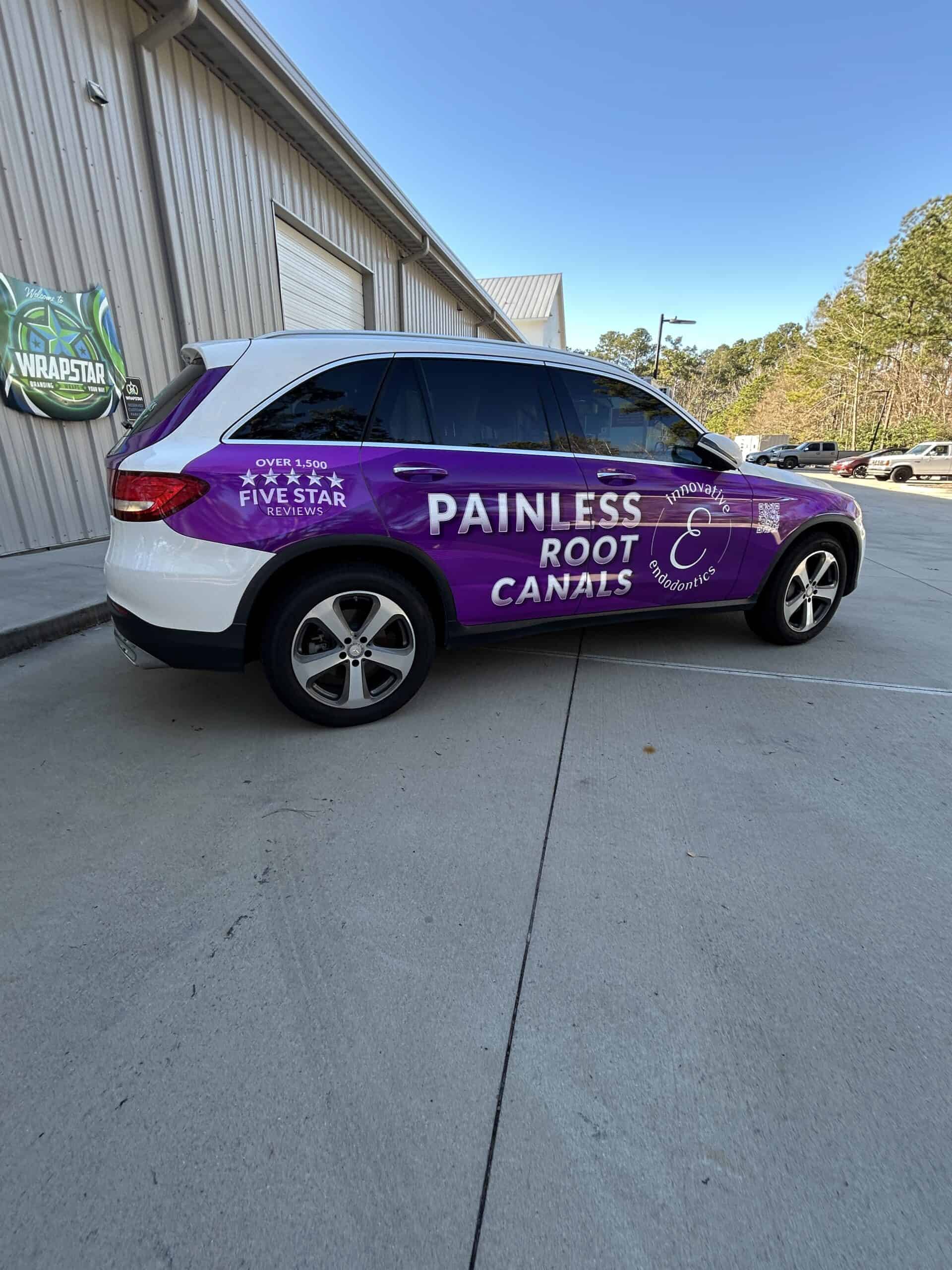 A white and purple SUV wrapped for Painless Root Canals with a five-star review graphic.
