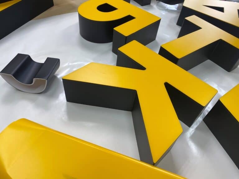 Custom yellow and black 3D commercial logo sign for Wrapstar Charleston.