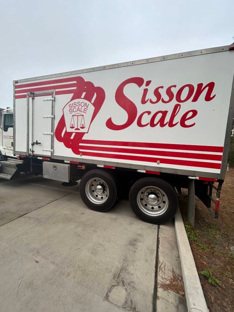 Commercial vehicle wrap for Sisson Scale in Charleston, showcasing professional branding.